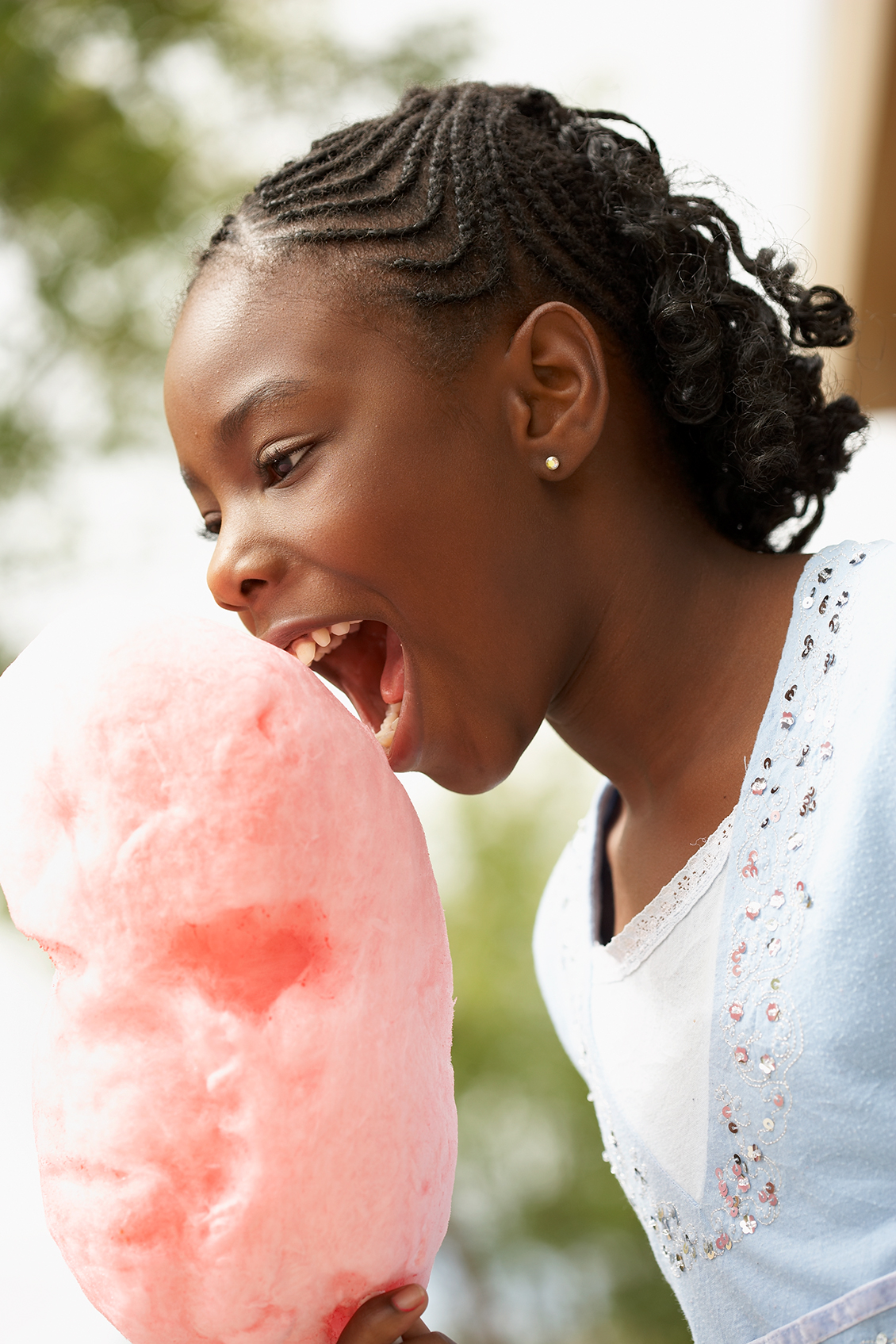 cute girl eating cotton candy photo art director