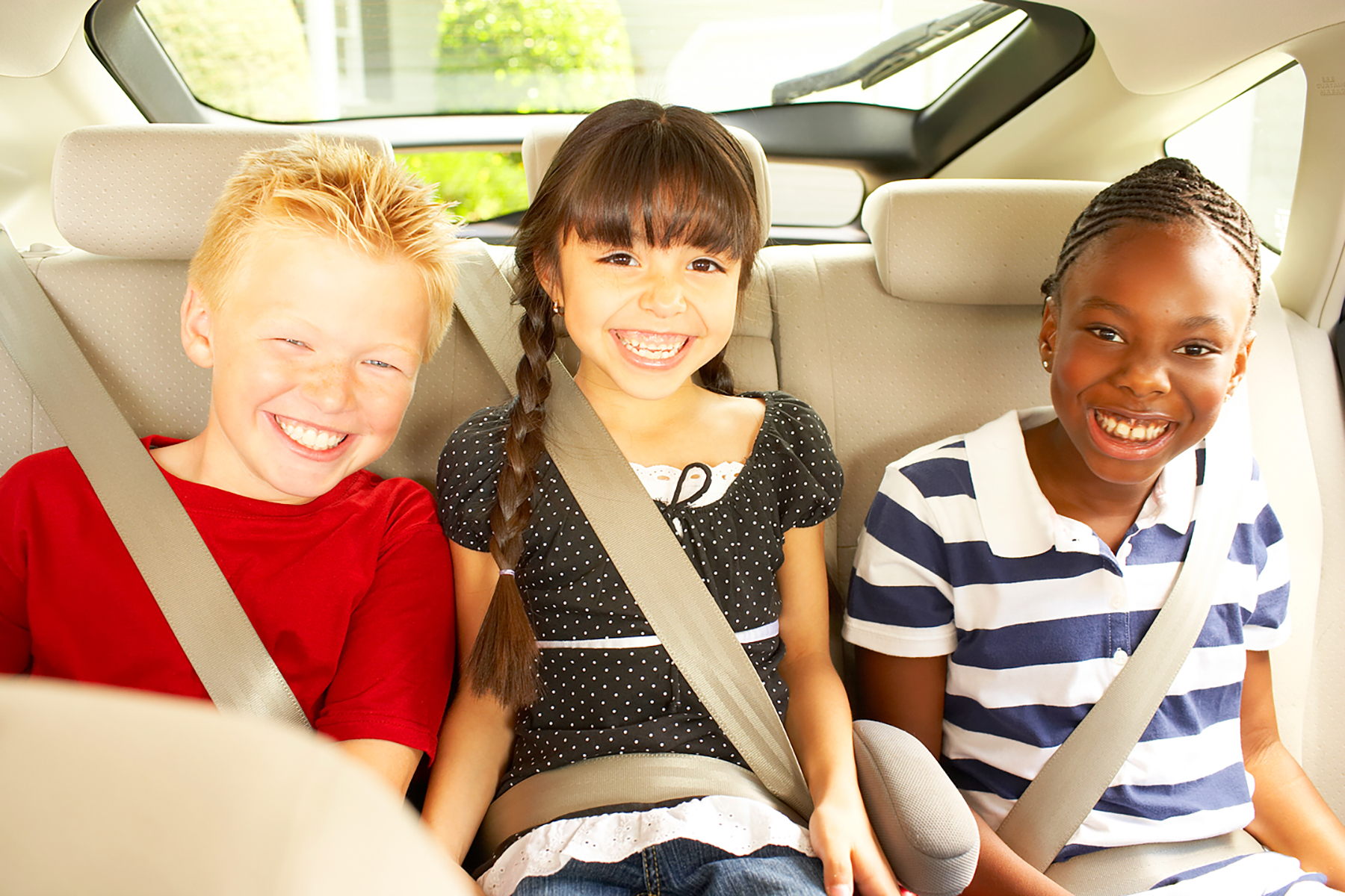 multi-racial kids in car corporate branding